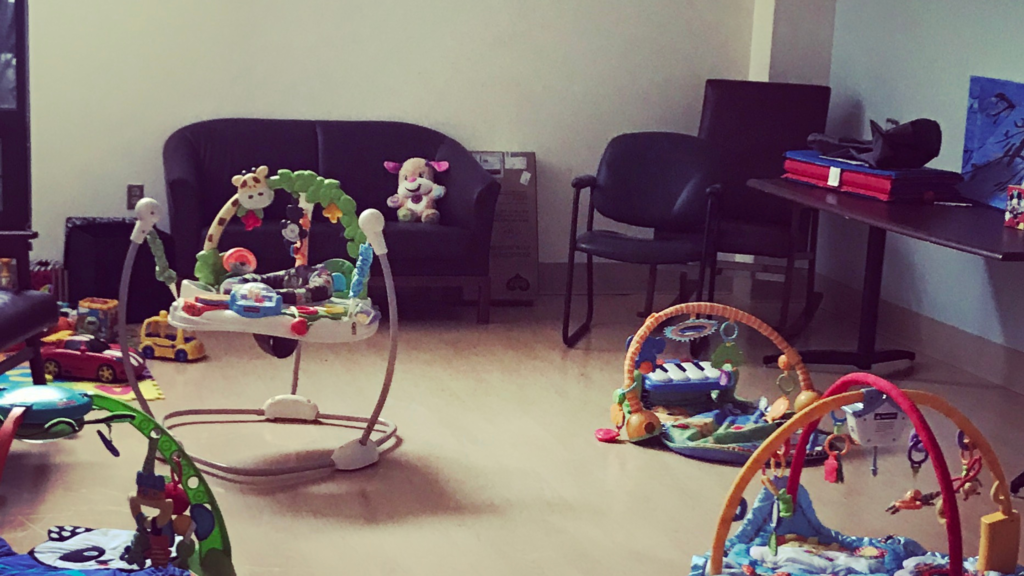empty support group with baby toys